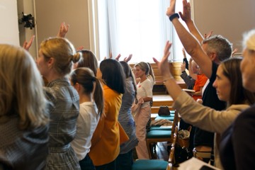 Participants raising their hands