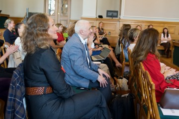 Participants talking in their seats