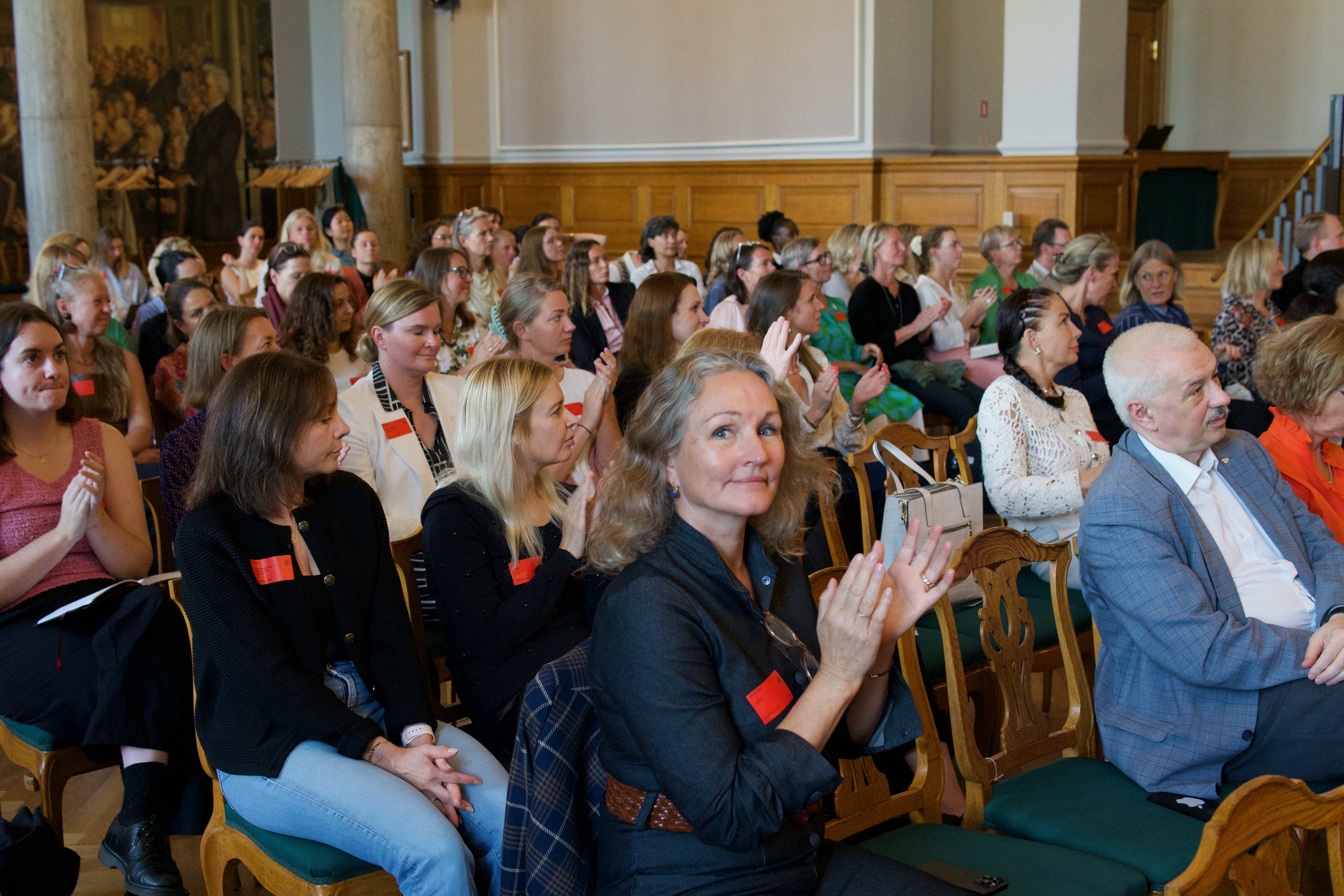 Audience applauding during the Charter co-creation event